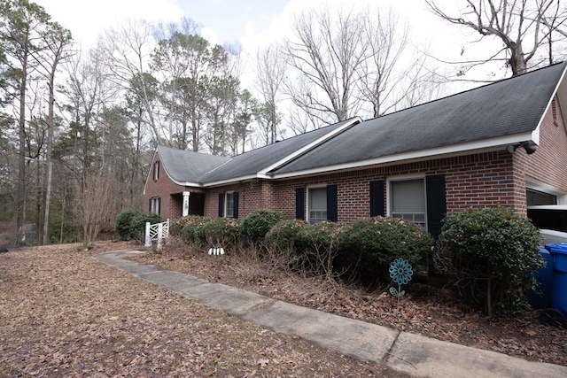 view of home's exterior with brick siding