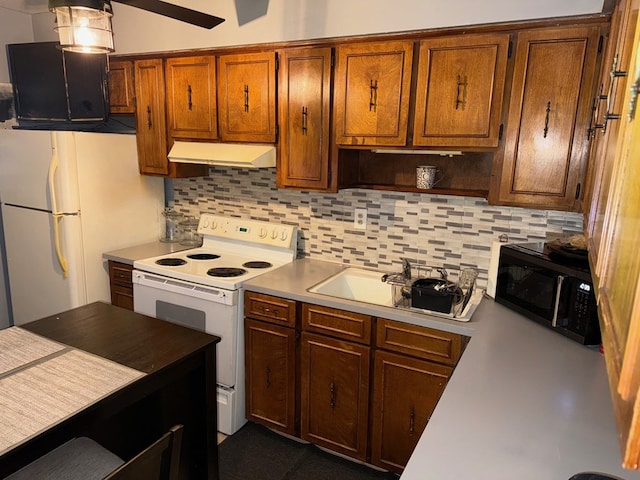 kitchen with white appliances, sink, and decorative backsplash