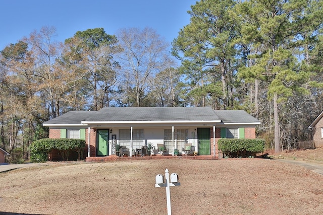 ranch-style home featuring a porch