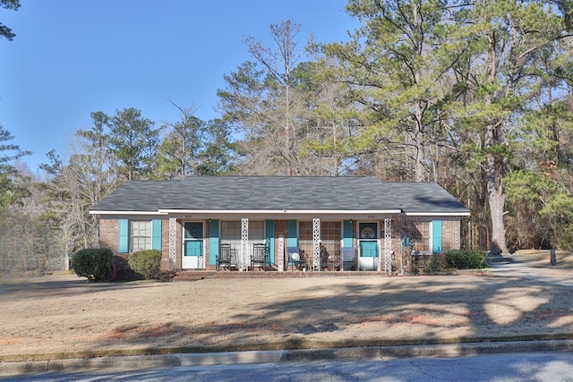 ranch-style house with covered porch