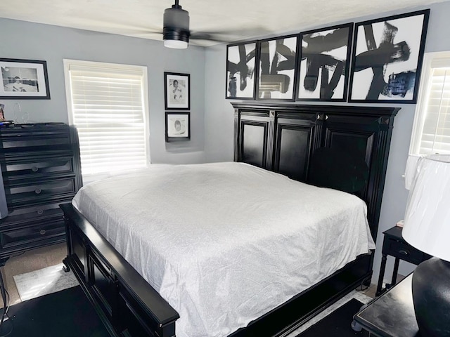 carpeted bedroom with ceiling fan