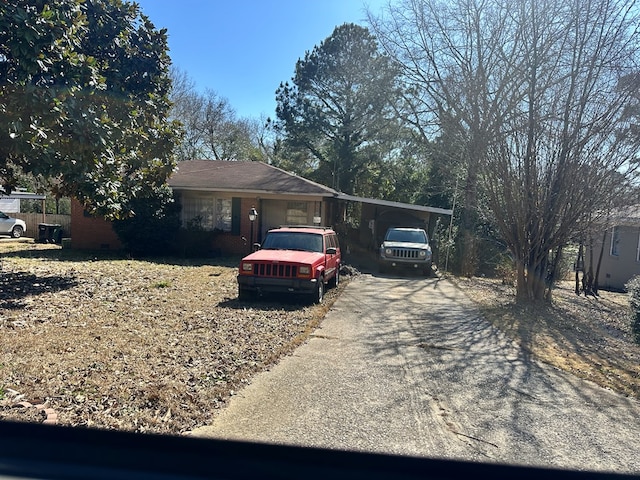 ranch-style home with a carport