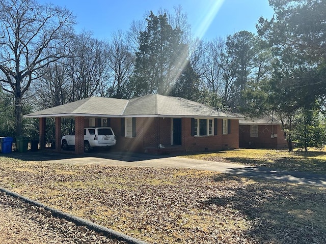 view of front of home with a carport