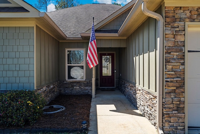 10 Cedarwood Ln, Phenix City, AL 36870 - entrance to property featuring stone siding, board and batten siding, and roof with shingles