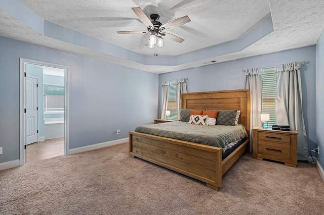 10 Cedarwood Ln, Phenix City, AL 36870 - bedroom with carpet flooring, a textured ceiling, multiple windows, baseboards, and a ceiling fan