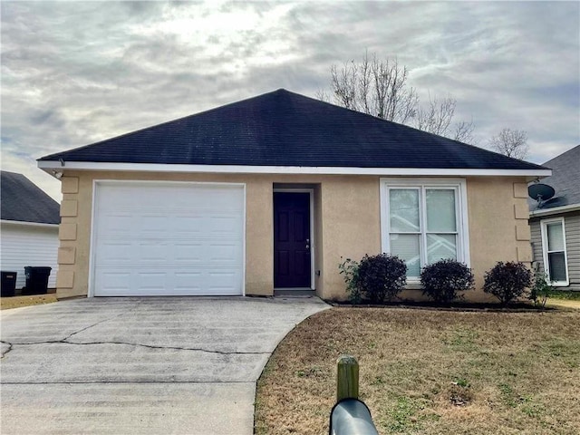 ranch-style house with concrete driveway, stucco siding, and roof with shingles