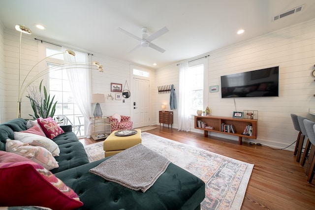 617 3rd Ave, Columbus, GA 31901 - living area with wood finished floors, ceiling fan, and wood walls