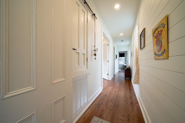 617 3rd Ave, Columbus, GA 31901 - hall featuring dark wood-type flooring, a barn door, recessed lighting, and wooden walls