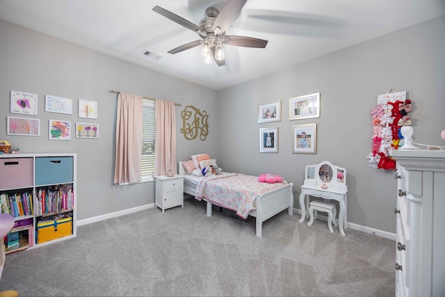 carpeted bedroom with baseboards and ceiling fan