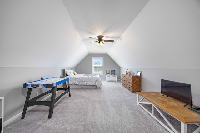 bedroom featuring carpet flooring, vaulted ceiling, a ceiling fan, and baseboards