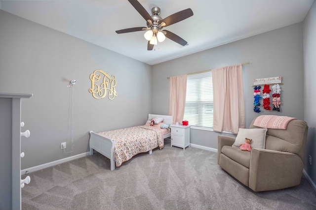 bedroom with baseboards, carpet flooring, and a ceiling fan