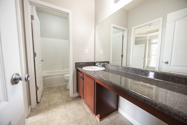 full bath featuring toilet, vanity, bathing tub / shower combination, and baseboards