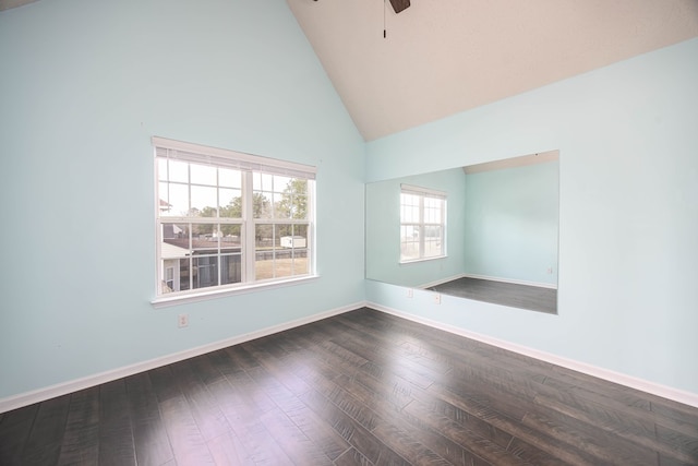 unfurnished room featuring dark wood finished floors, ceiling fan, high vaulted ceiling, and baseboards