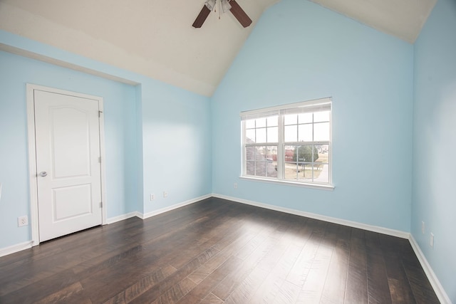 unfurnished room with a ceiling fan, dark wood-type flooring, baseboards, and vaulted ceiling