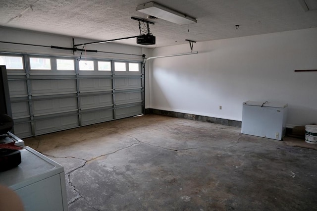 garage with fridge and a garage door opener