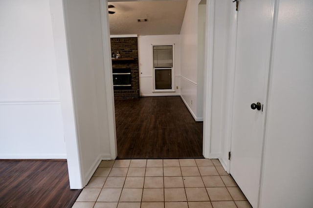 hallway featuring light tile patterned flooring