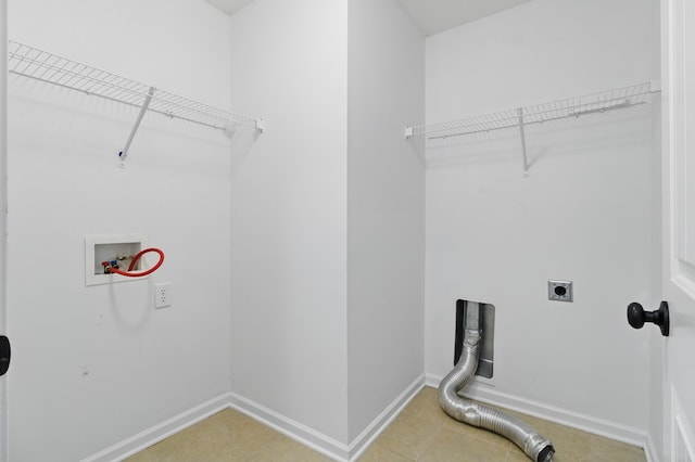laundry room featuring hookup for a washing machine, electric dryer hookup, baseboards, and light tile patterned floors