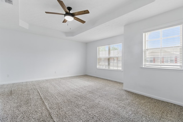 unfurnished room featuring ceiling fan, carpet, and baseboards