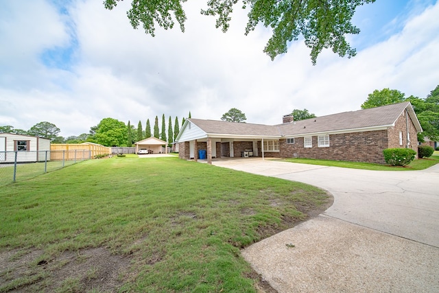 2310 Nottingham Dr, Columbus, GA 31904 - rear view of property featuring driveway, brick siding, a garage, and a chimney
