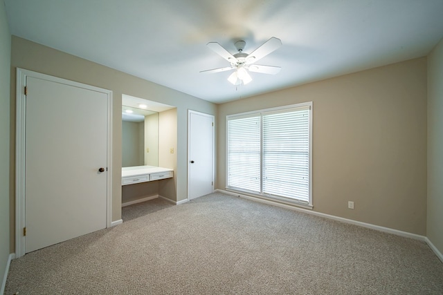2310 Nottingham Dr, Columbus, GA 31904 - unfurnished bedroom featuring light carpet, baseboards, and ceiling fan