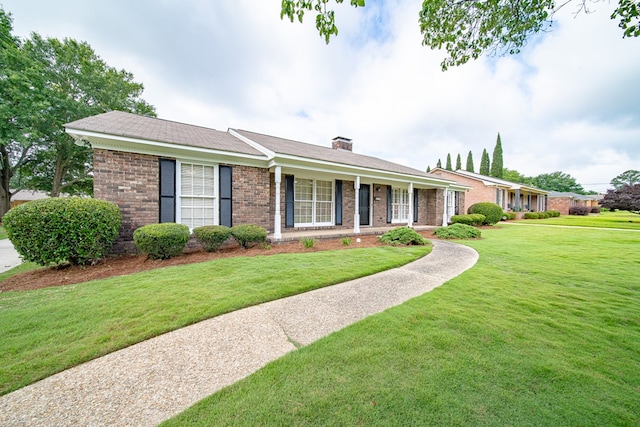2310 Nottingham Dr, Columbus, GA 31904 - single story home with brick siding, a front lawn, and a chimney