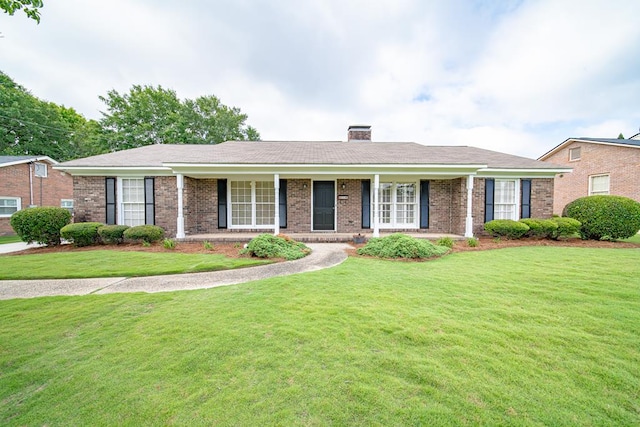 2310 Nottingham Dr, Columbus, GA 31904 - ranch-style house with brick siding, a front lawn, a chimney, and a porch