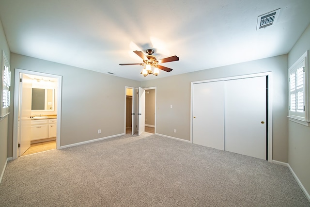 2310 Nottingham Dr, Columbus, GA 31904 - unfurnished bedroom featuring light carpet, a closet, and baseboards