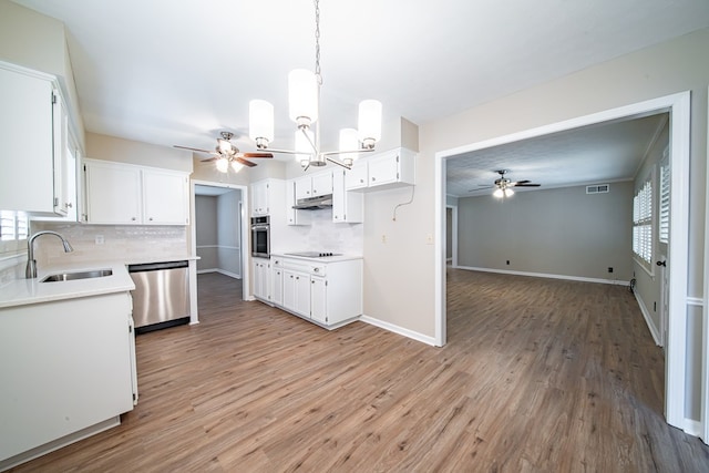 2310 Nottingham Dr, Columbus, GA 31904 - kitchen with stainless steel appliances, a sink, a ceiling fan, and backsplash