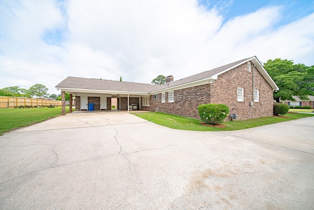 2310 Nottingham Dr, Columbus, GA 31904 - view of front of property with driveway, brick siding, a chimney, and an attached carport