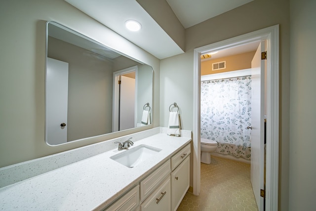 2310 Nottingham Dr, Columbus, GA 31904 - bathroom featuring toilet, vanity, a shower with shower curtain, and tile patterned floors