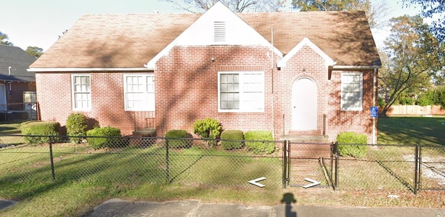 202 S Maple St, Tuskegee, AL 36083 - view of front of home featuring brick siding and a gate