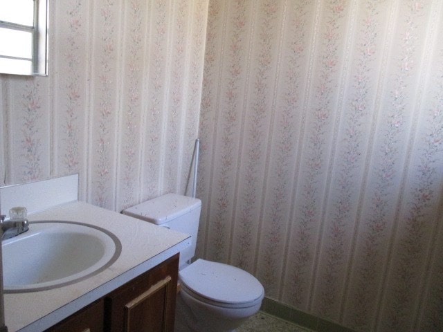 bathroom with vanity and toilet