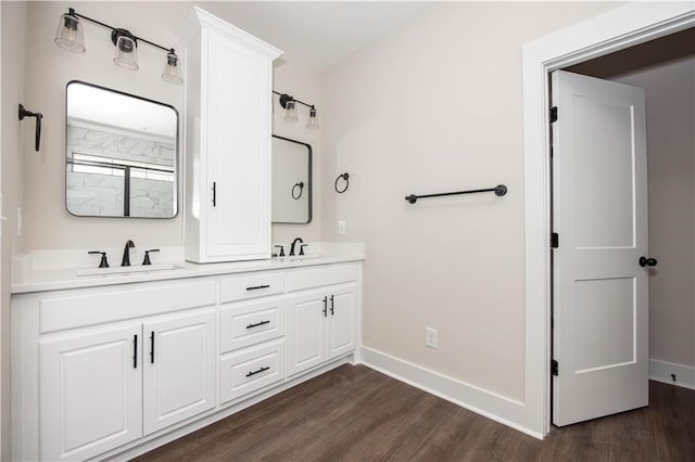 bathroom featuring hardwood / wood-style floors and vanity