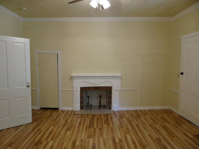 unfurnished living room with a tile fireplace, light hardwood / wood-style flooring, ceiling fan, and crown molding