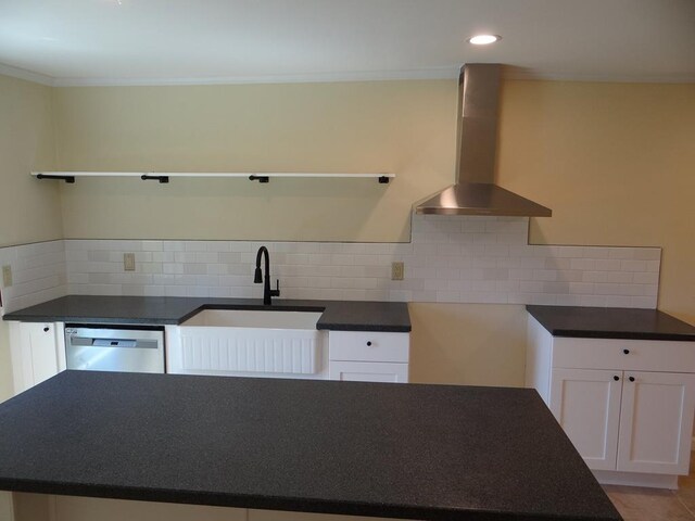 kitchen with white cabinets, dishwasher, wall chimney range hood, and tasteful backsplash