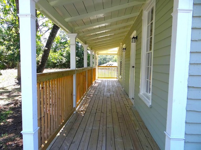 wooden terrace with a porch