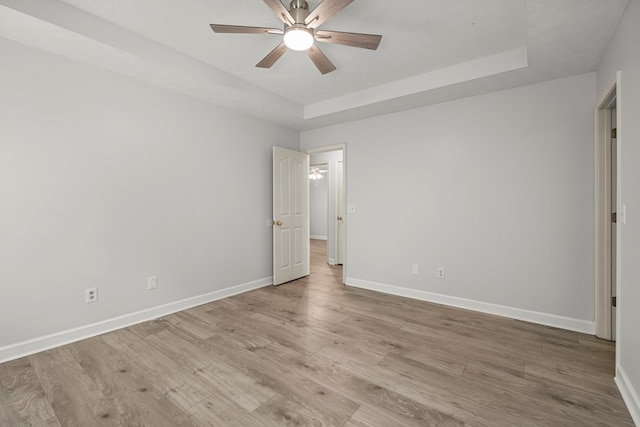 180 Plum Ct, Columbus, GA 31909 - unfurnished bedroom with light wood-type flooring, a tray ceiling, and ceiling fan