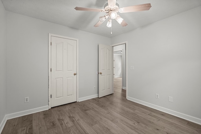 180 Plum Ct, Columbus, GA 31909 - unfurnished bedroom with wood finished floors and ceiling fan
