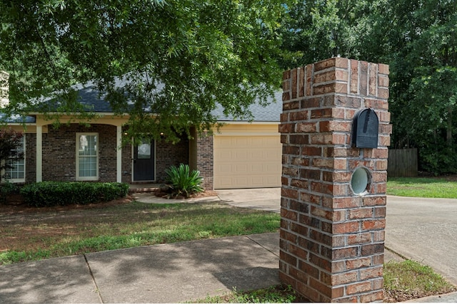 180 Plum Ct, Columbus, GA 31909 - view of front of house featuring concrete driveway, a garage, brick siding, and roof with shingles