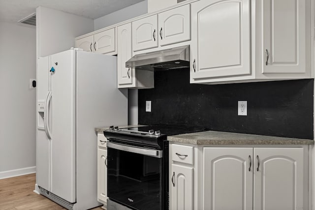 180 Plum Ct, Columbus, GA 31909 - kitchen with stainless steel electric range, under cabinet range hood, white fridge with ice dispenser, light wood-style flooring, and white cabinetry