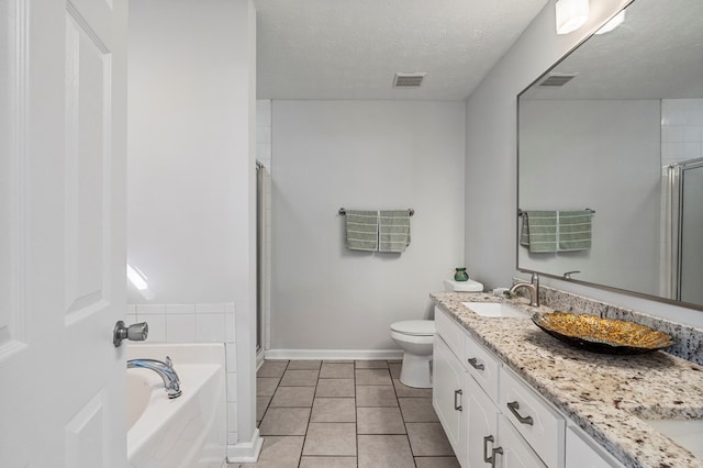 bathroom featuring a garden tub, a shower stall, visible vents, and a sink