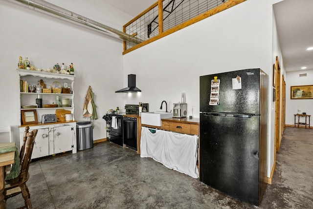 129 Hayes Rd, Mauk, GA 31058 - kitchen with black appliances, finished concrete floors, wall chimney exhaust hood, recessed lighting, and open shelves