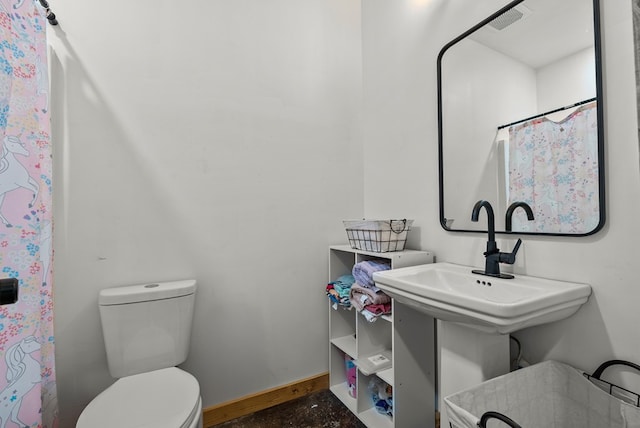 129 Hayes Rd, Mauk, GA 31058 - bathroom with toilet and baseboards