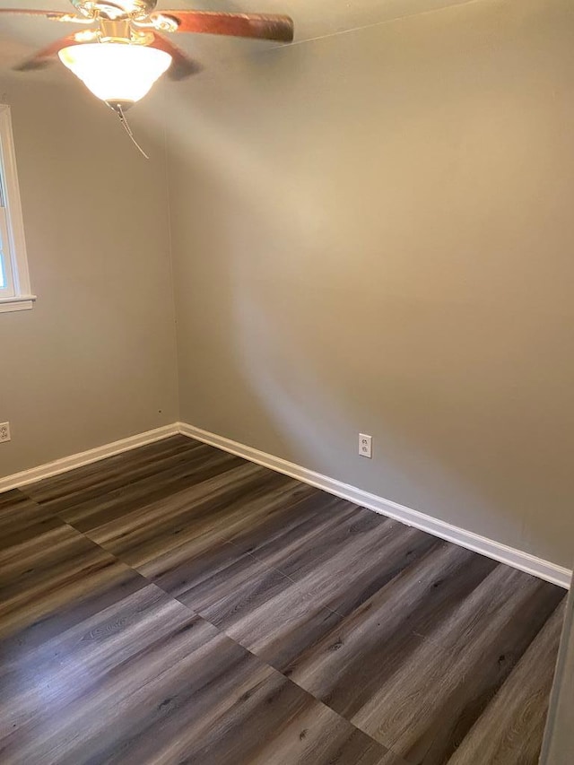 spare room featuring dark hardwood / wood-style floors