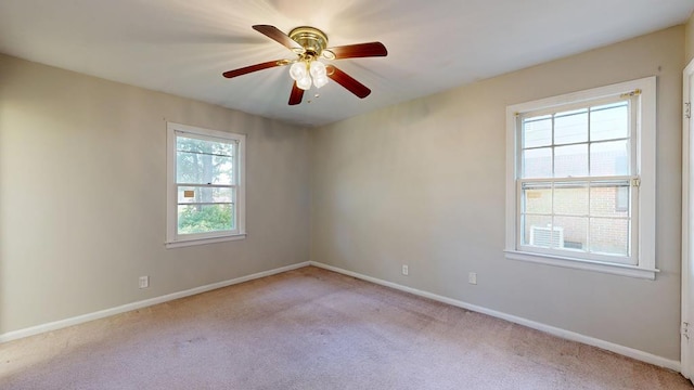 unfurnished room featuring carpet, baseboards, and ceiling fan