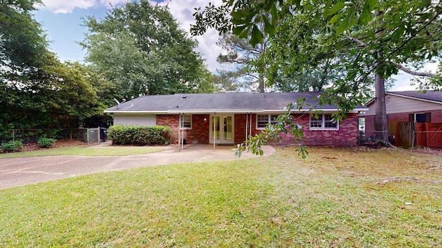 view of front facade featuring french doors and brick siding