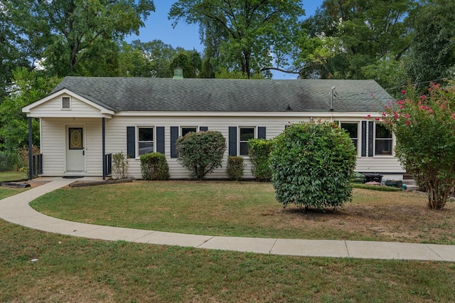 ranch-style home with a front lawn