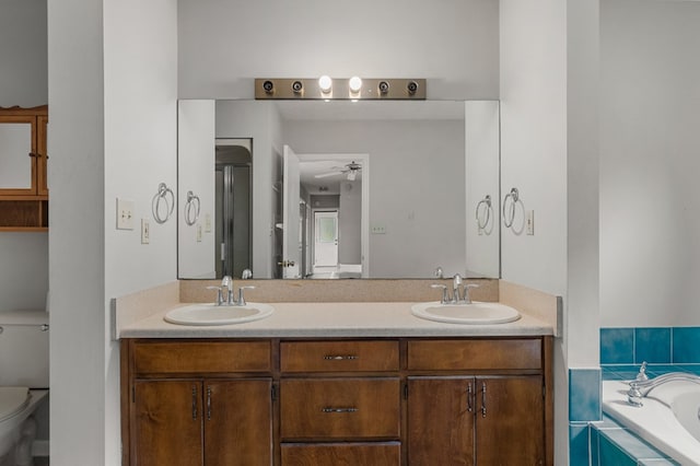 full bathroom with shower with separate bathtub, vanity, toilet, and ceiling fan