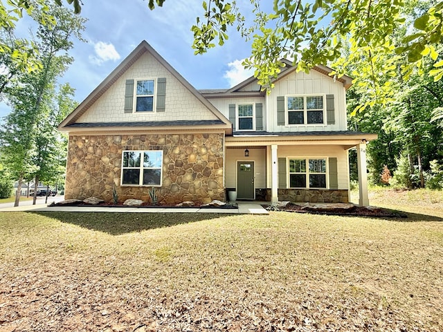 craftsman-style home featuring stone siding and board and batten siding