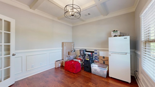misc room with beamed ceiling, a notable chandelier, coffered ceiling, and wood finished floors